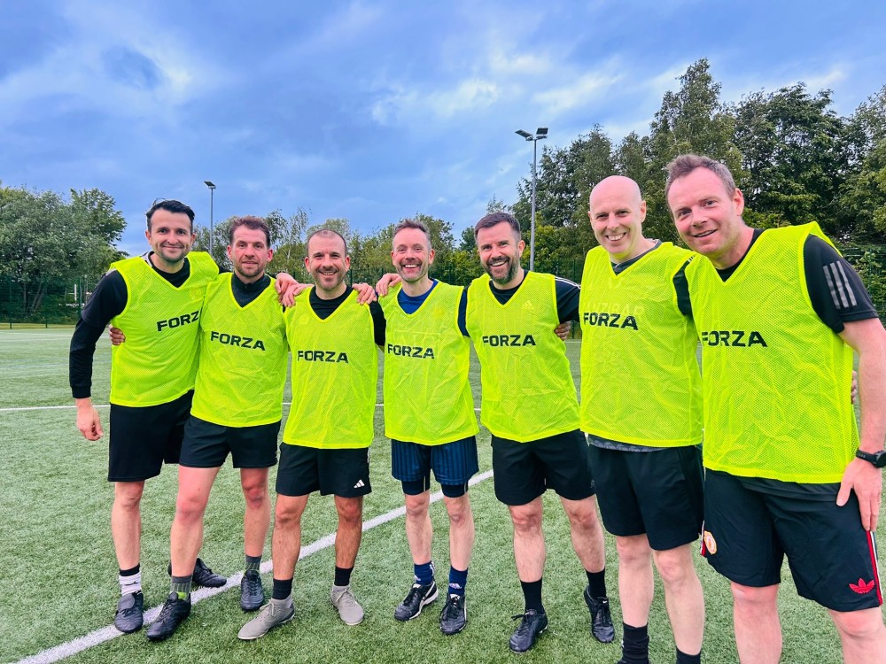 Group of men wearing high vis vests