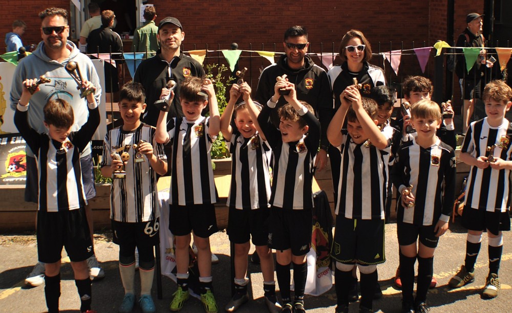 group of children with trophies