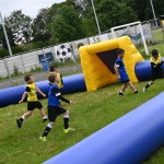 kids playing on inflatable pitch
